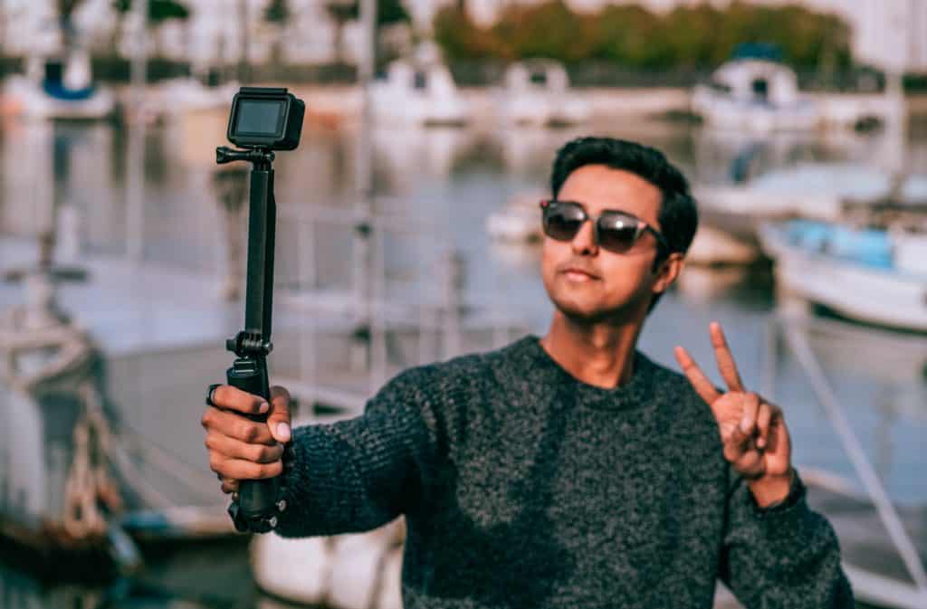 Boy using a selfie stick to take a selfie